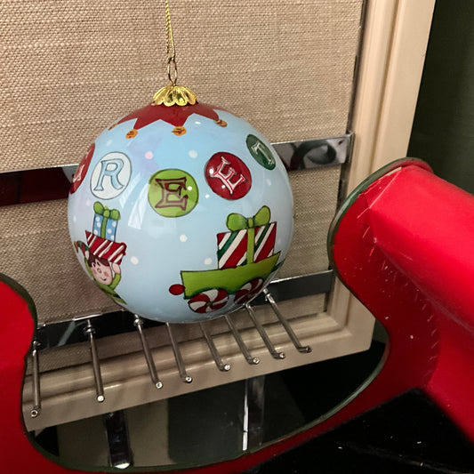 Pier 1 Li Polen Greetings 2012 painted and glazed ornament in ornate red felt box