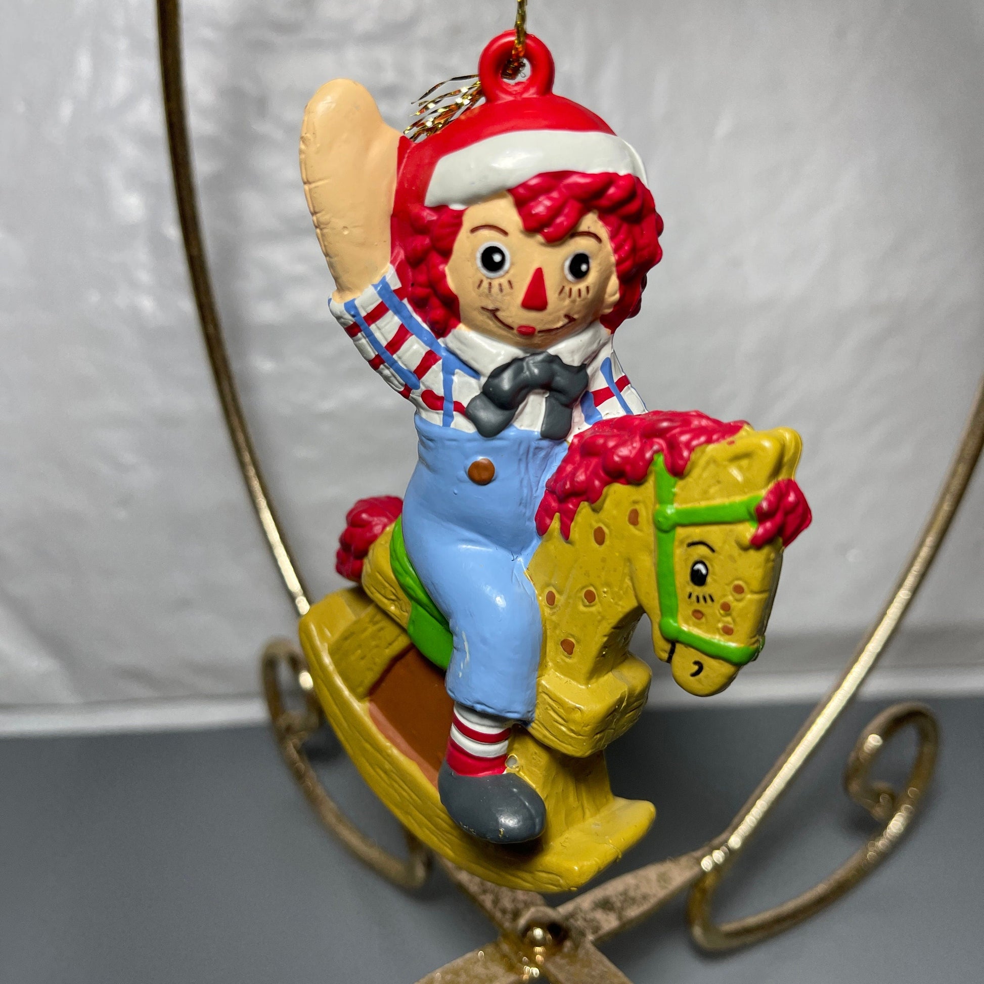 Raggedy Andy In Santa Cap Riding A Rocking Horse Christmas Tree Ornament