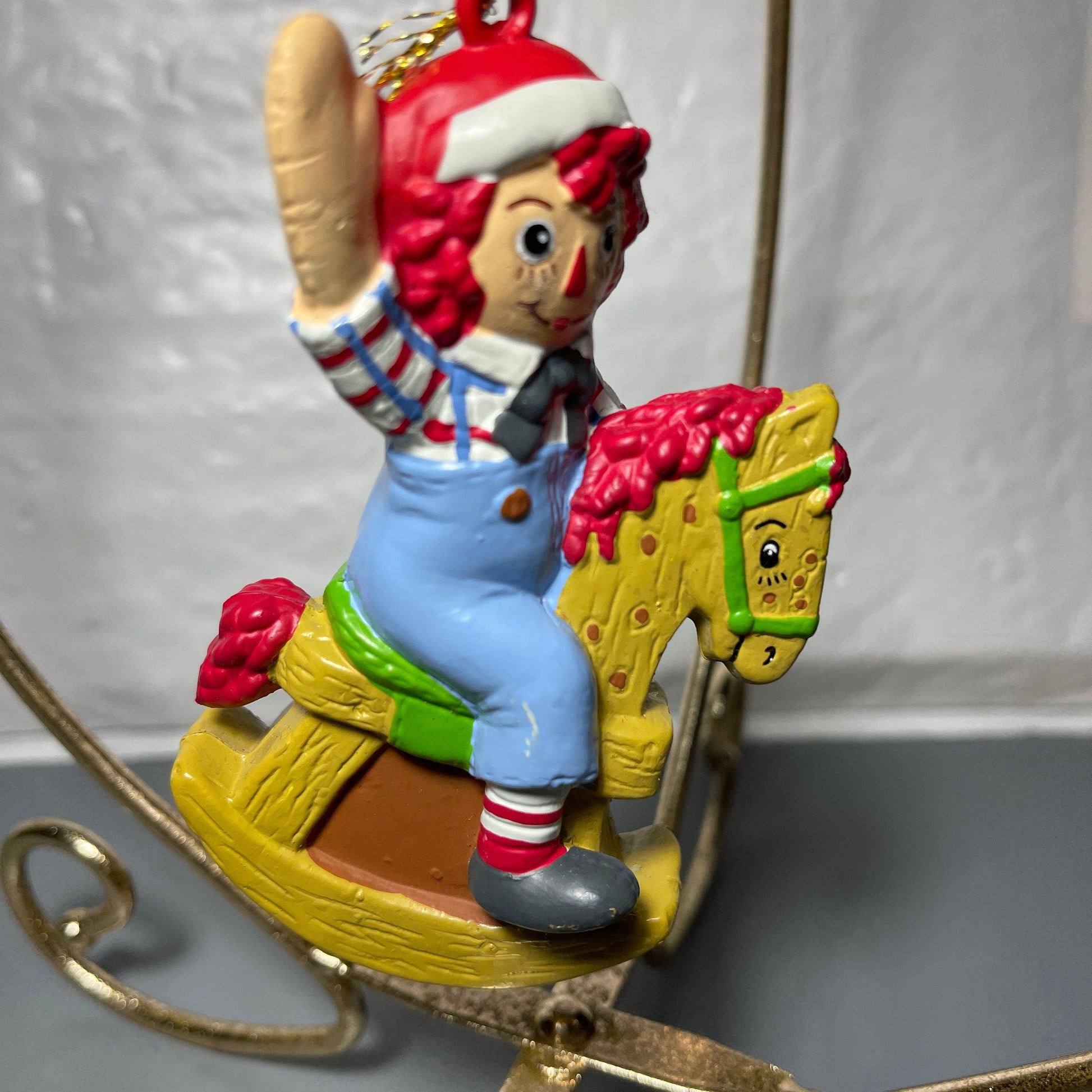 Raggedy Andy In Santa Cap Riding A Rocking Horse Christmas Tree Ornament