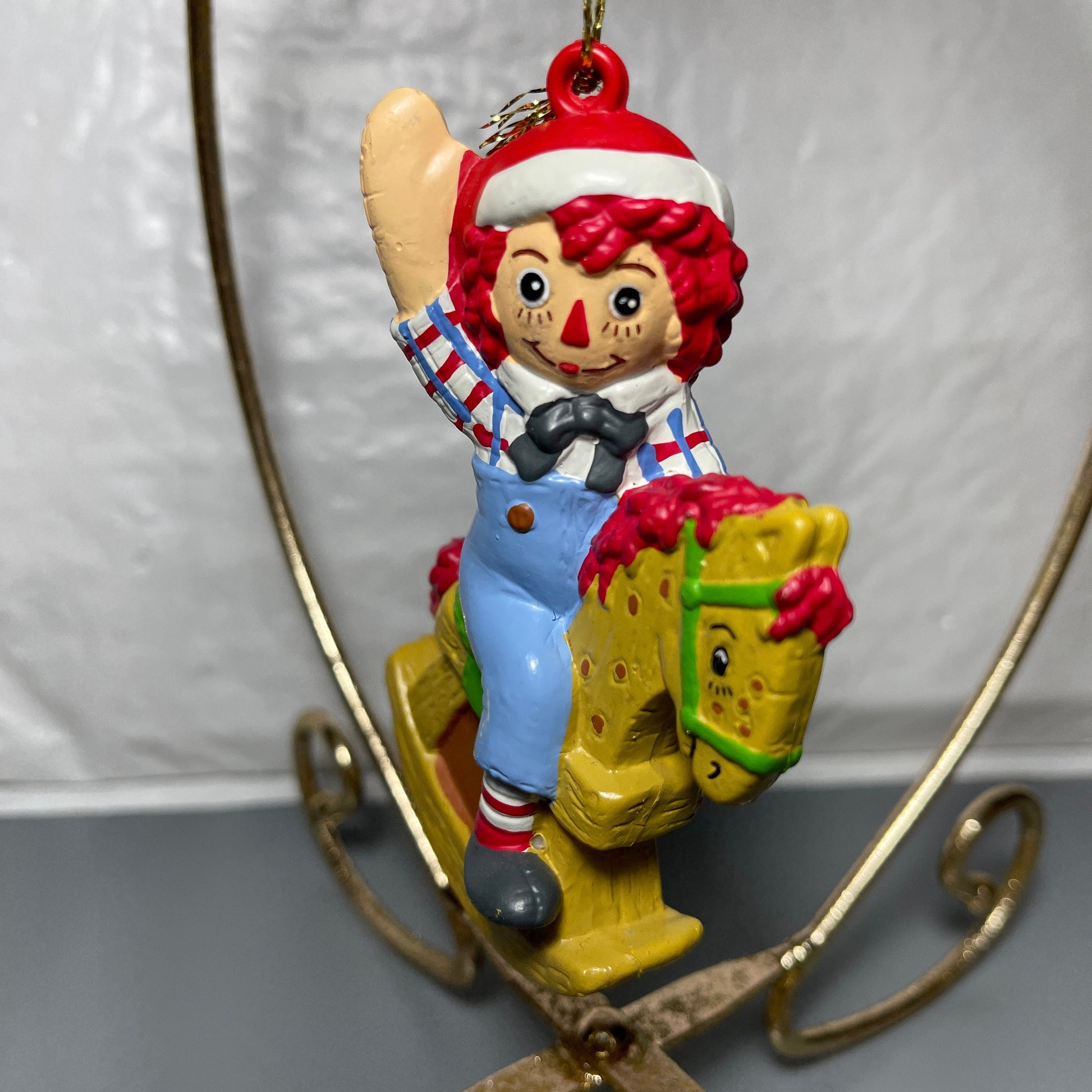 Raggedy Andy In Santa Cap Riding A Rocking Horse Christmas Tree Ornament