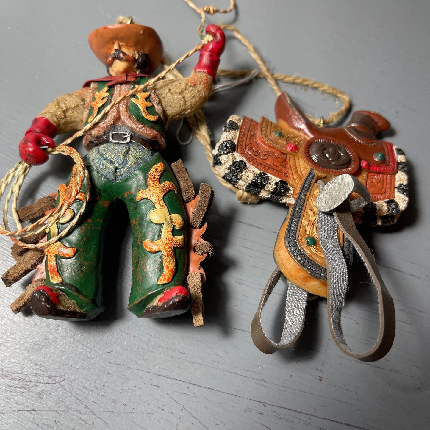 Lasso Cowboy and Saddle with Stirrups Set Of 2 Western Christmas Ornaments