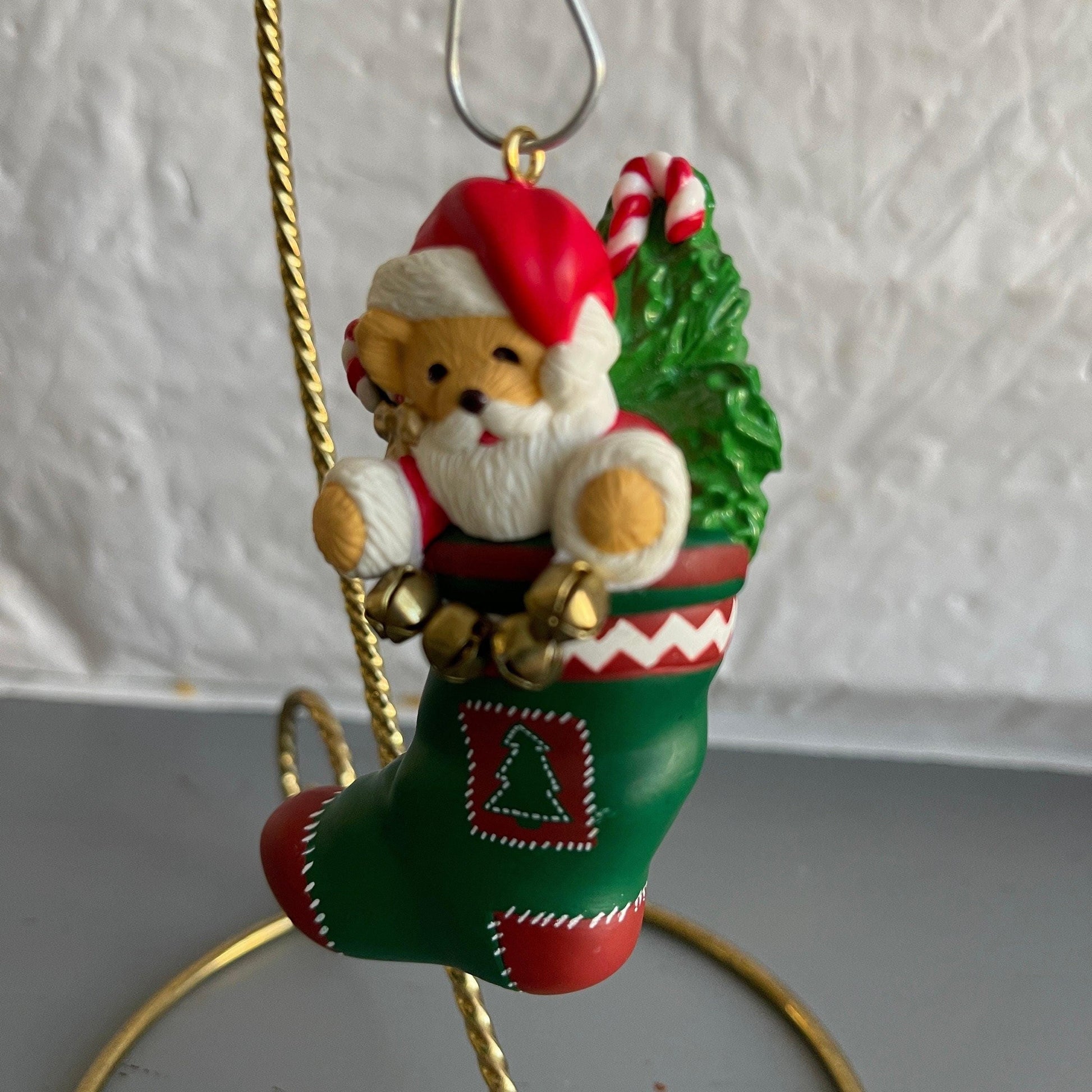 Hallmark Teddy Bear Santa Holding a String Of Metal Bells In A stocking Dated 1996 Christmas Ornament