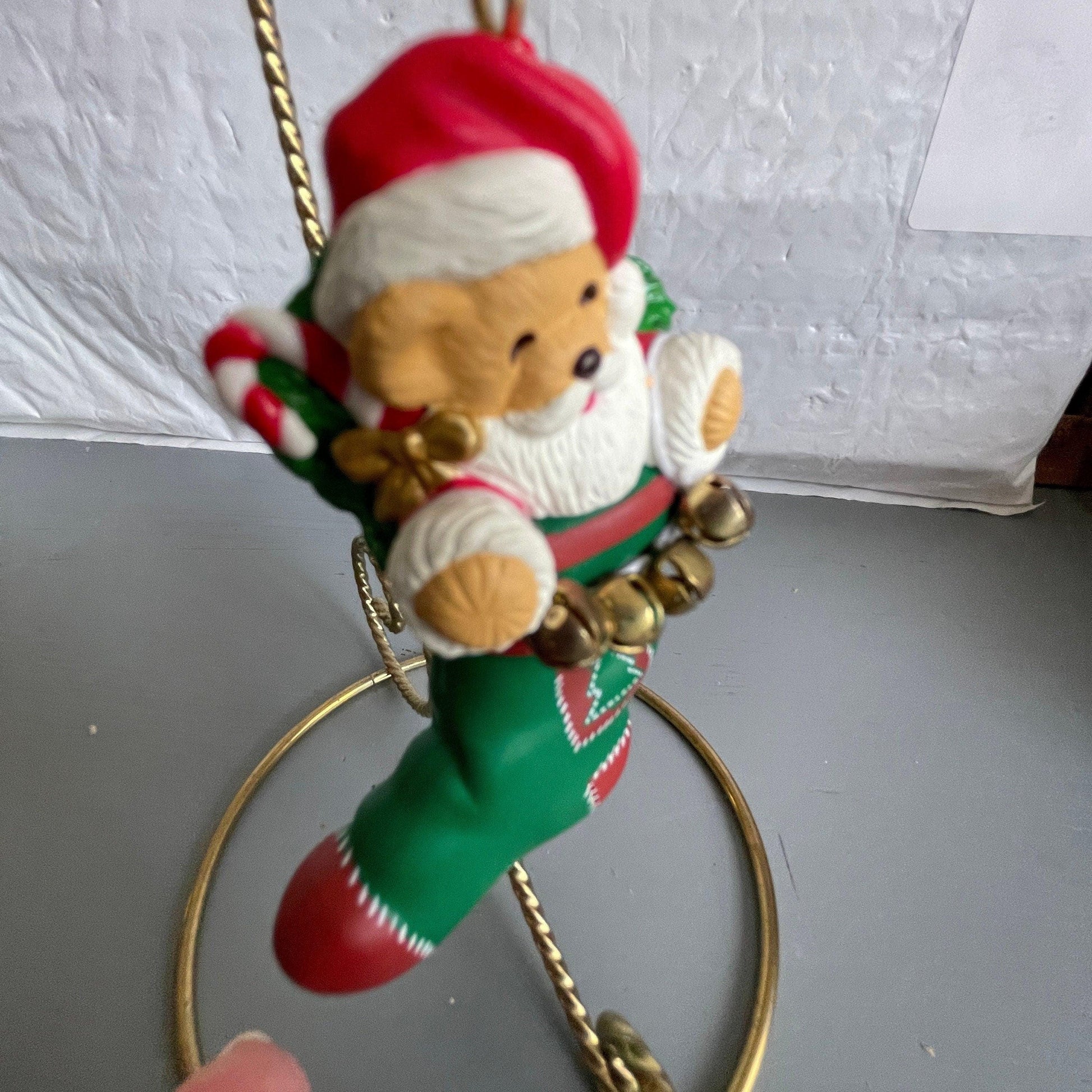 Hallmark Teddy Bear Santa Holding a String Of Metal Bells In A stocking Dated 1996 Christmas Ornament