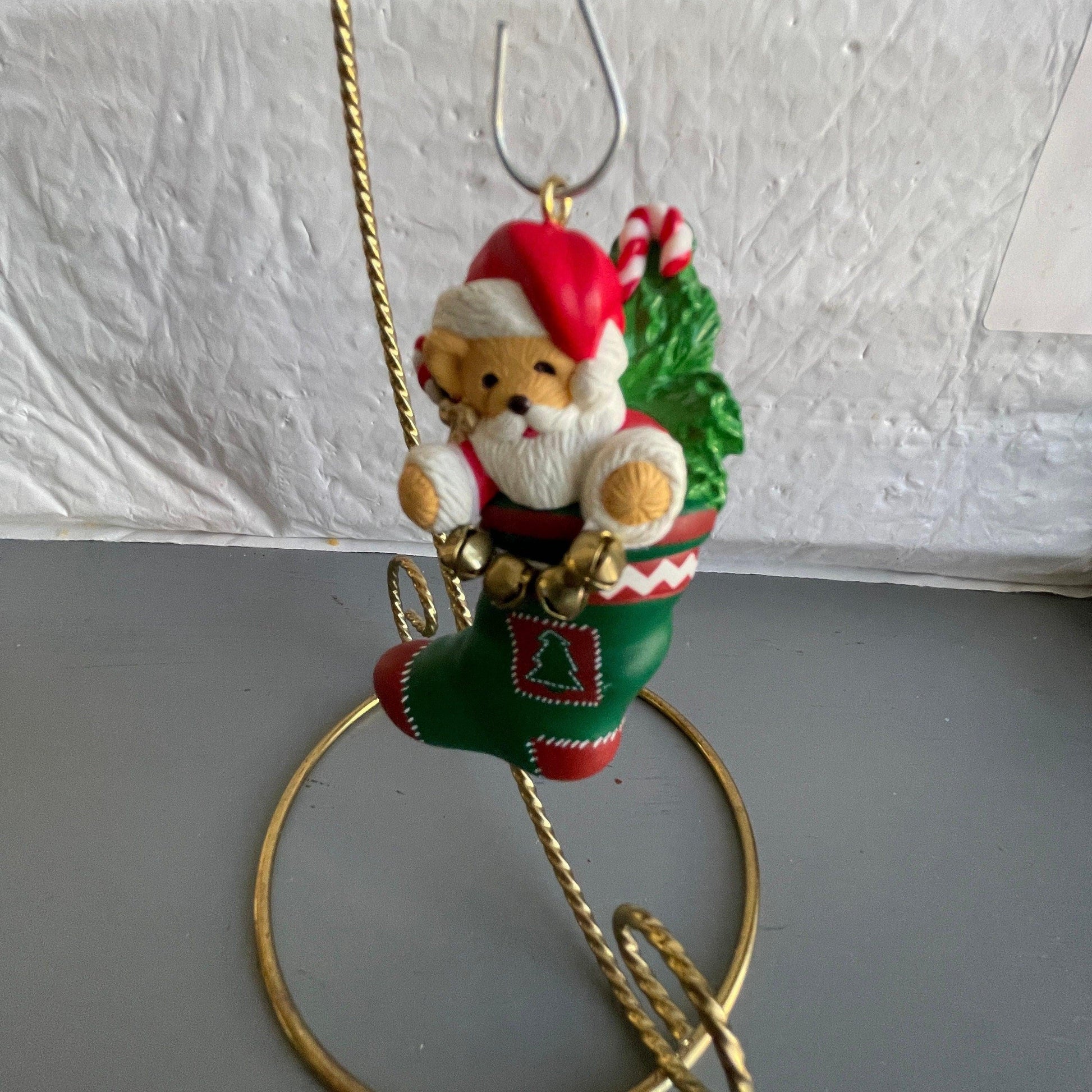Hallmark Teddy Bear Santa Holding a String Of Metal Bells In A stocking Dated 1996 Christmas Ornament