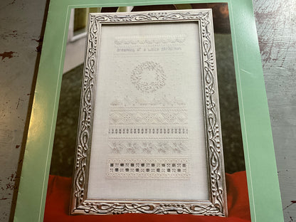 The Victoria Sampler White Christmas cross stitch chart with fabric and embellishment pack